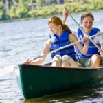 a couple is enjoy a canoe ride