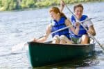 a couple is enjoy a canoe ride