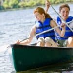 a couple is enjoy a canoe ride