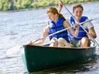 a couple is enjoy a canoe ride