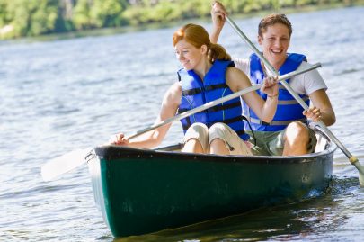 a couple is enjoy a canoe ride