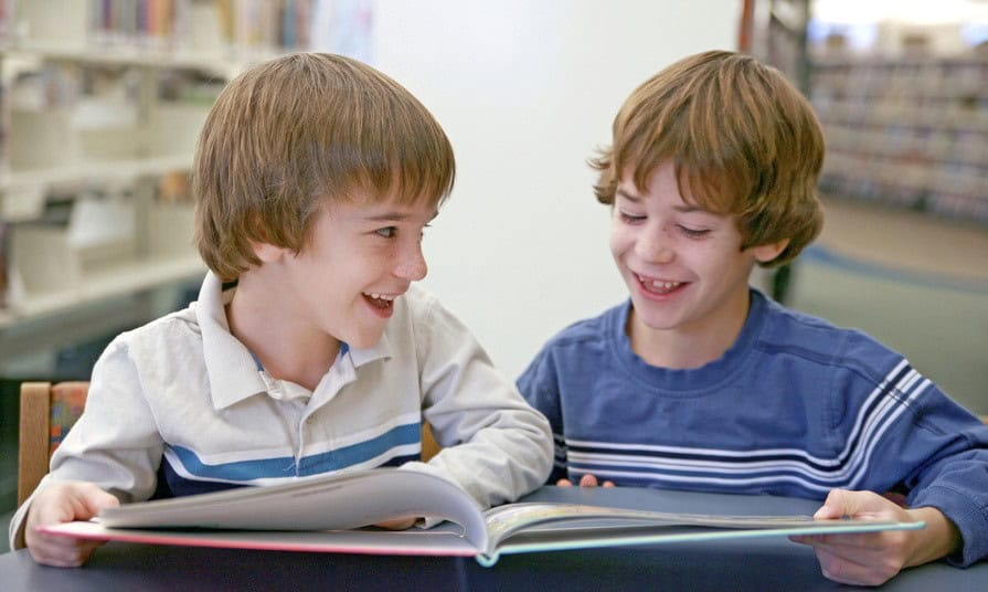 boys reading a book