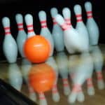 bowling lane, pins, and ball