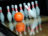 bowling lane, pins, and ball