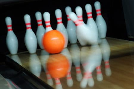 bowling lane, pins, and ball