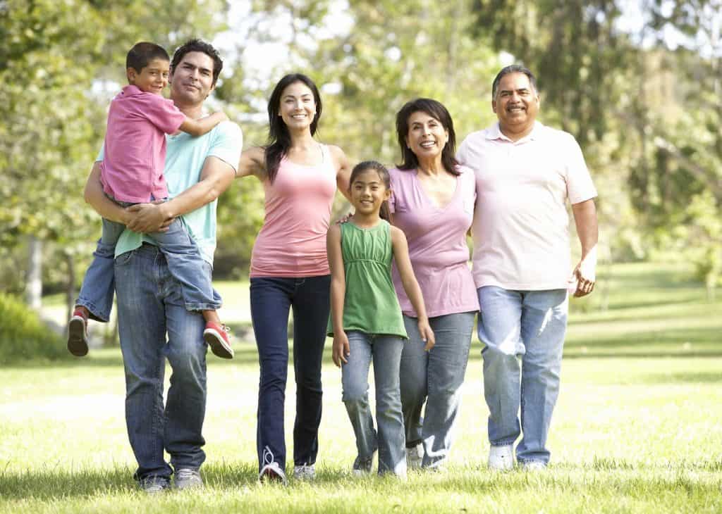 Extended Family Walking In Park photo by monkeybusiness - DepositPhotos.com