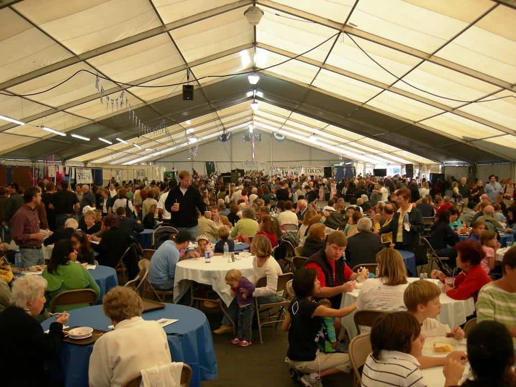 Crowd in pavillion tent, St. Demetrios Greek Festival, Seattle, WA photo by Joe Mabel (CC3)