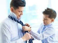 Father and son getting dressed