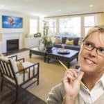 Woman daydreaming about home improvements - DepositPhotos.com