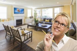 Woman daydreaming about home improvements - DepositPhotos.com