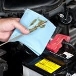 Auto Mechanic Checking Oil