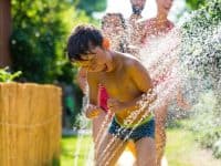 young boy enjoying the spray park