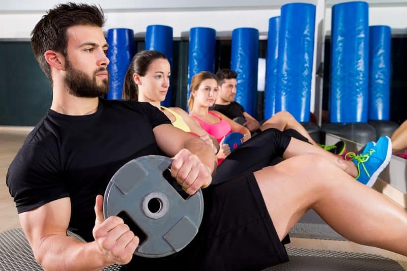 Abdominal plate training core group at gym - DepositPhotos.com