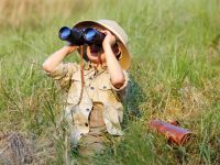 Explorer kid with binoculars