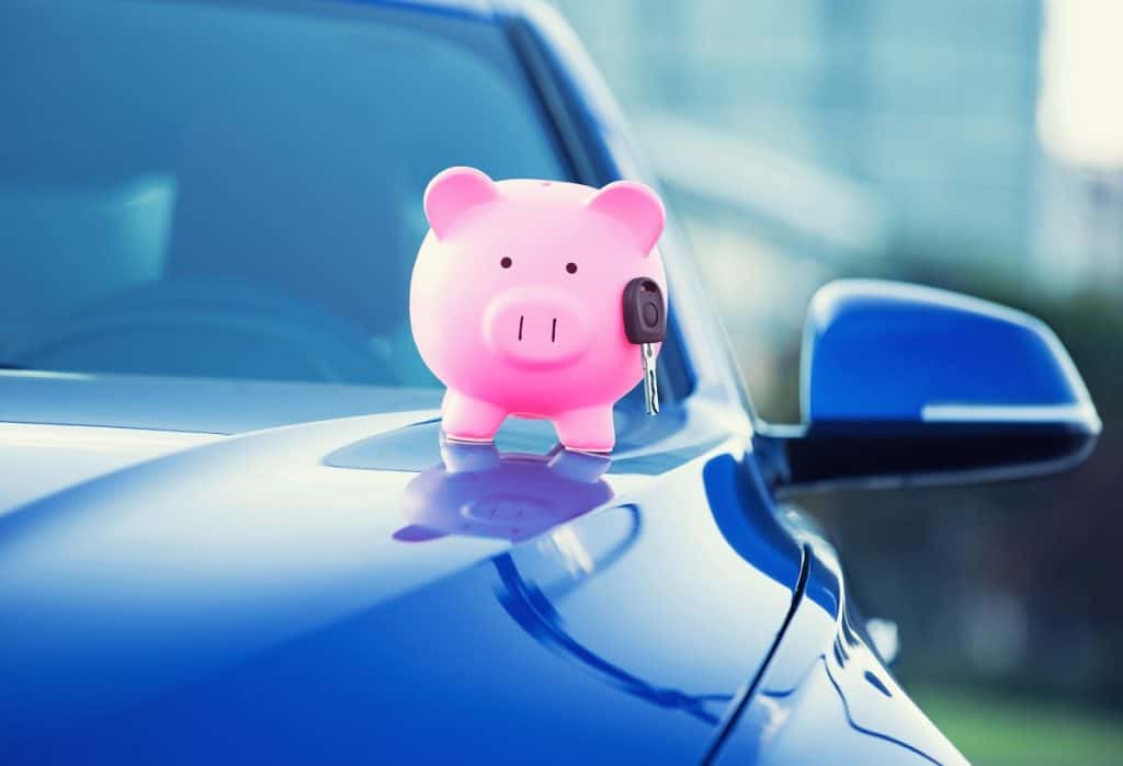 new car key and piggy bank