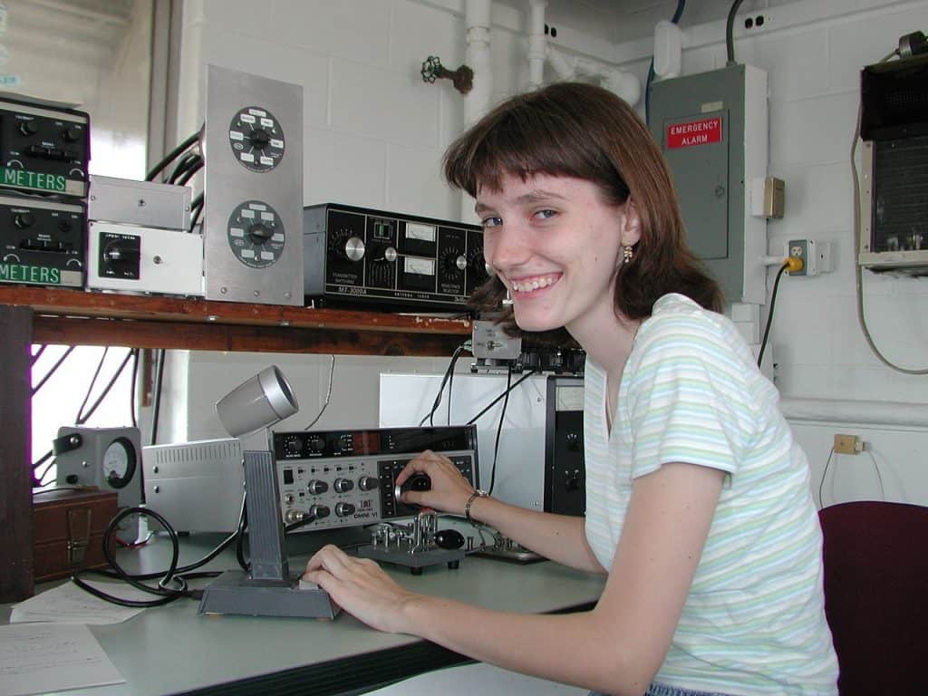 Amateur 'ham' radio operator, Yvette Cendes, KB3HTS, at station W8EDU, 2005. Photo by Andromeda321 at en.wikipedia (Yvette Cendes) (CC3)