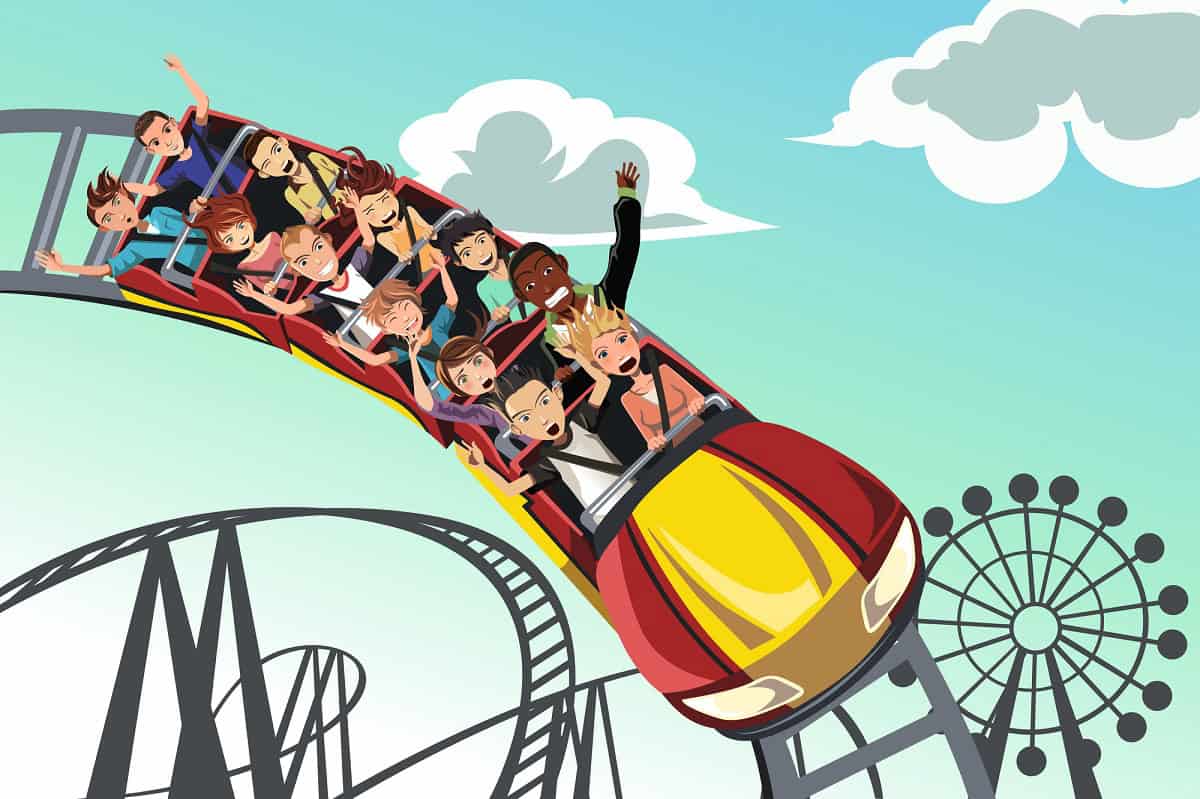 People riding roller coaster