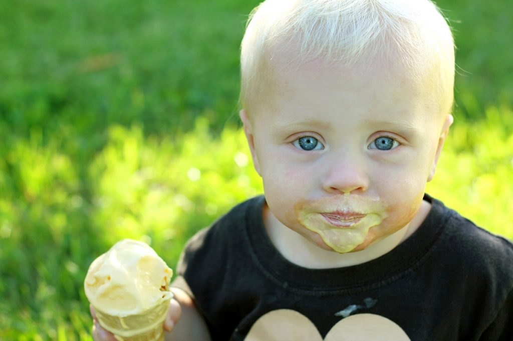 Messy Baby Eating Ice Cream Cone
