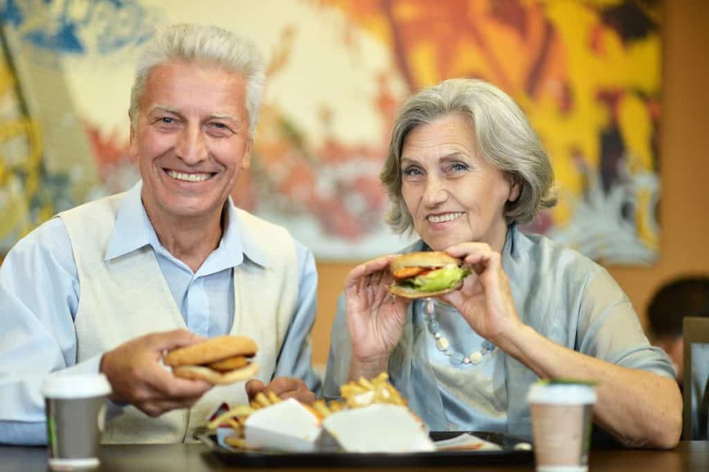 Senior couple enjoying fast food meal photo by aletia - Depositphotos.com