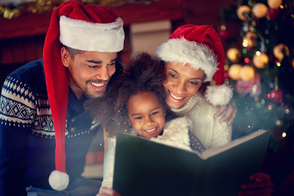 Family reading Christmas book together