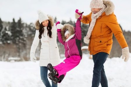 family walking on snowy day