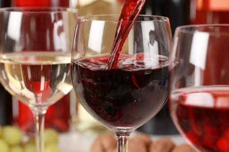 pouring a glass of red wine