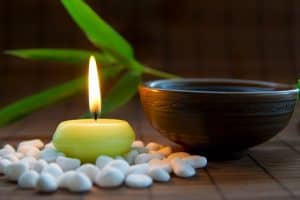 Candles, tea, and zen stones create harmony for meditation practice - DepositPhotos.com