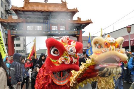 Lion dancers at Historic Chinatown Gate in Seattle, WA for Chinese New Year 2011 Photo by Joe Mabel (CC3)