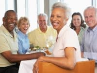 Group of senior citizens enjoying a restaurant meal