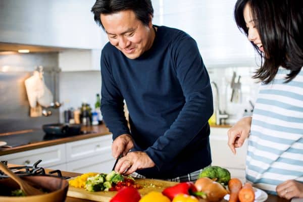 couple cooking together at home