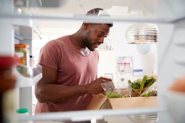 unloading a delivered meal kit at home