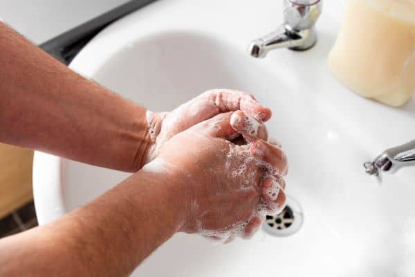 man washing his hands