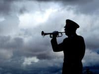 bugle player playing taps