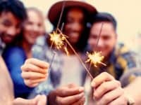 Groups of friends celebrating with sparklers