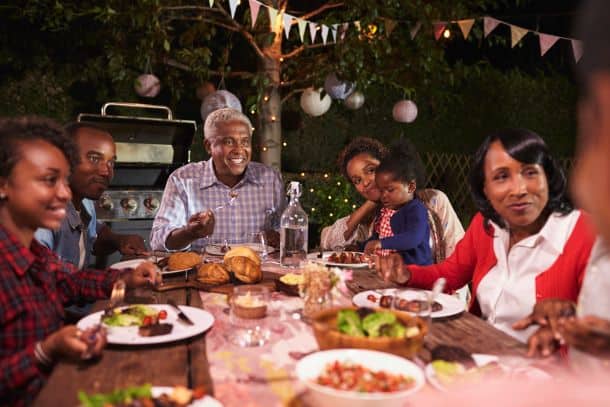 Family enjoying backyard barbecue