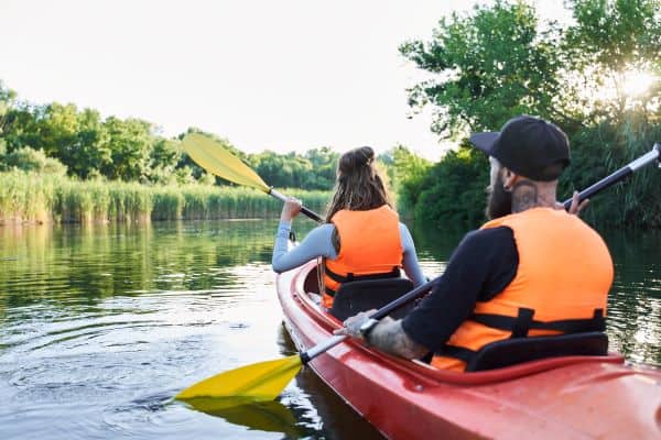 couple in a kayak on a river