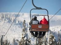 skiiers on a chair lift