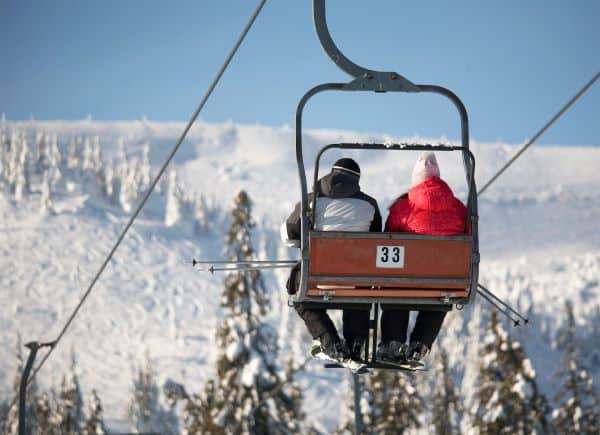 skiiers on a chair lift