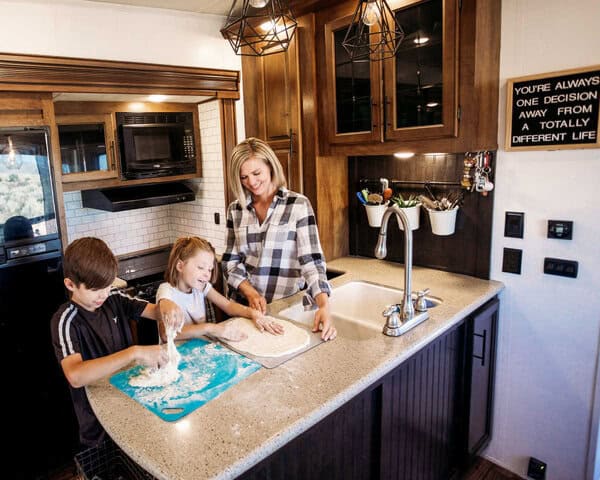 mom & kids cooking in an rv kitchen