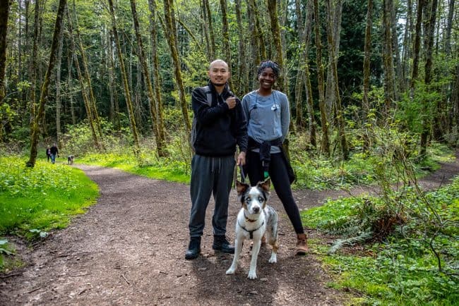 A couple and their dog on a Cougar Mountain trail walk