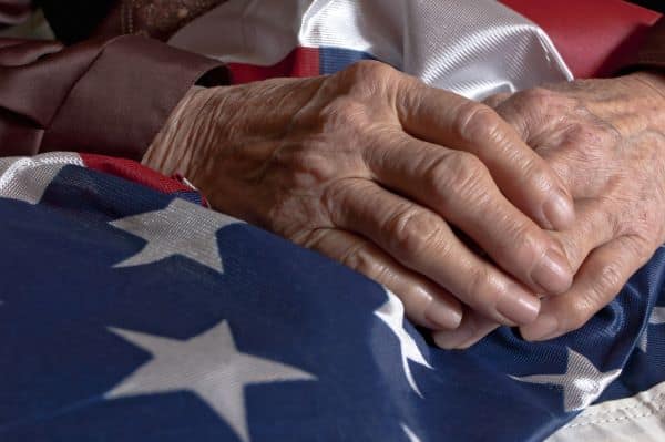 Veteran holding American flag