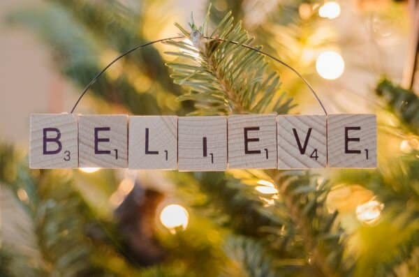 Lighted tree with "believe" in scrabble tiles