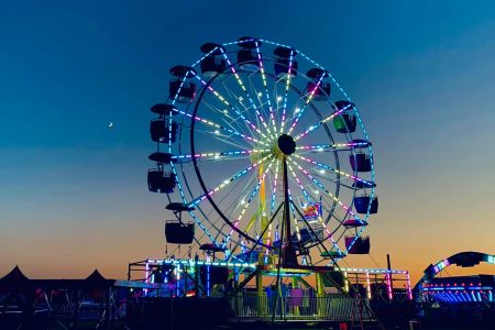 Ferris wheel at night. Carnival at Harvey Field 2021