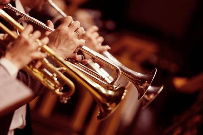 trumpet players in an orchestra