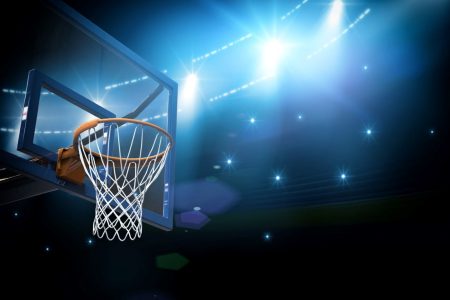 basketball arena hoop under bright lights