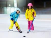 young girls playing ice hockey
