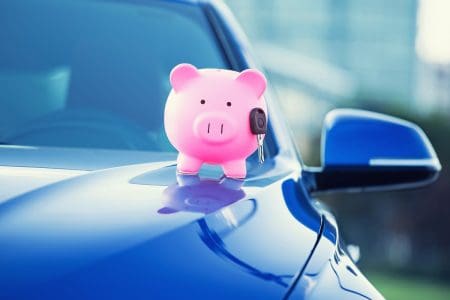new car key and piggy bank