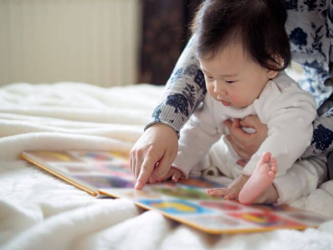 parent reading with baby